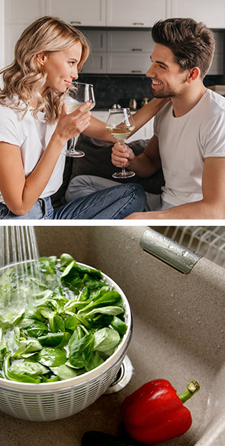 Couple in the kitchen with wine glasses